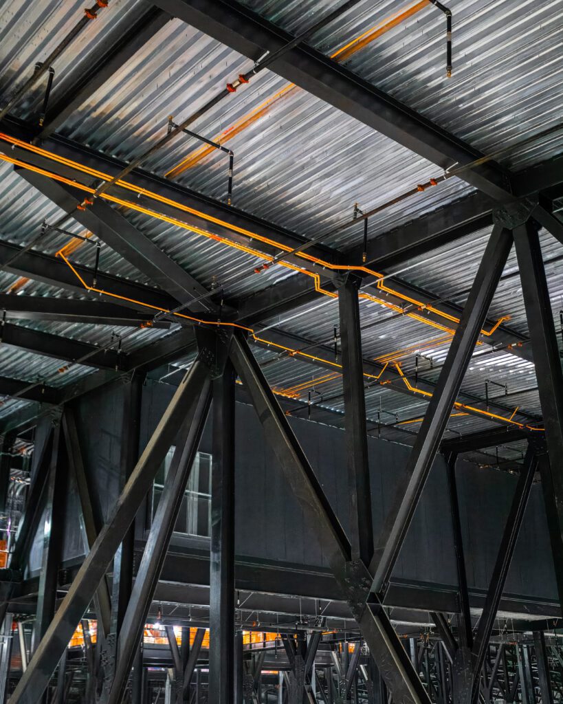 Modern office building equipped with the latest Xtralis VESDA aspirating smoke detectors, integrated seamlessly into the existing fire alarm system.