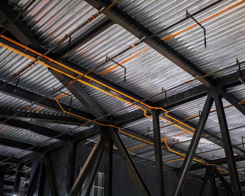 Highly sensitive Xtralis VESDA aspirating smoke detection system installed in a data center, protecting critical infrastructure from fire risks.